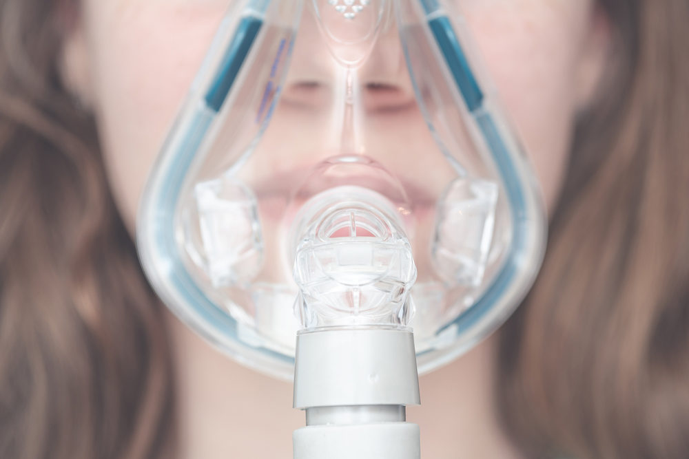 cpap mask on the girl's face.