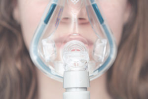 cpap mask on the girl's face.