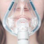 cpap mask on the girl's face.
