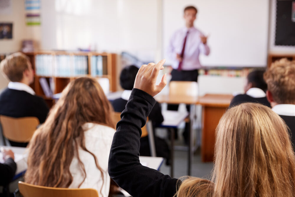 Timothy Delaney, Science Teacher Arrested for Child Molestation in Seminole County, FL Female Student Raising Hand To Ask Question In Classroom