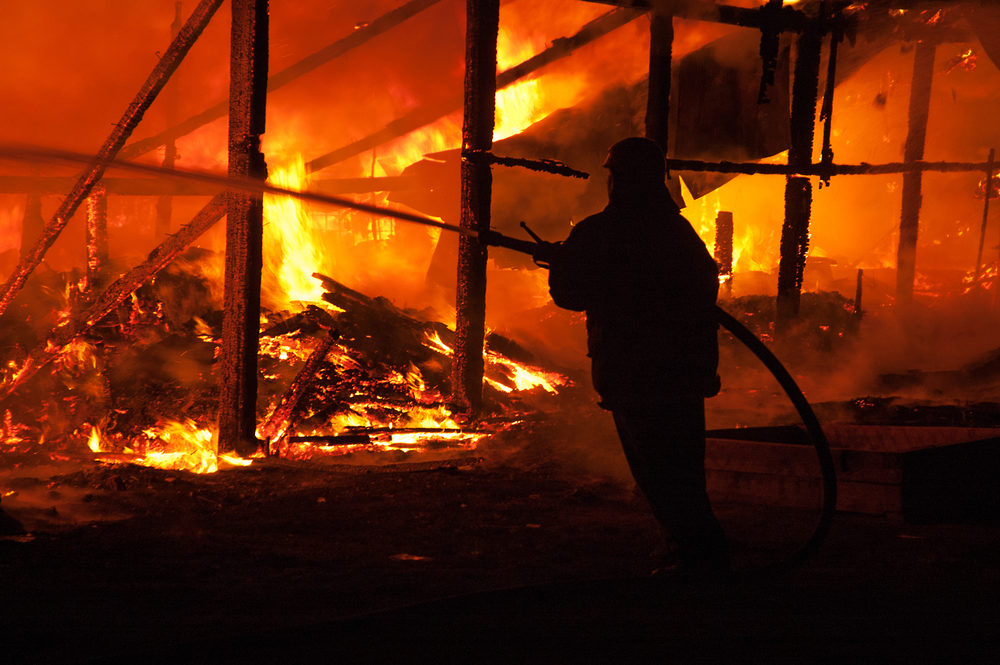 Firefighters extinguish a house