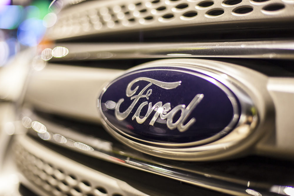 Close-up of the Ford company logo on the front of a vehicle