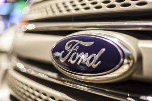 Close-up of the Ford company logo on the front of a vehicle