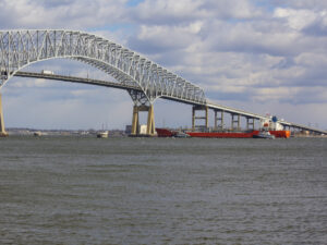tugboats assisting a tanker approaching Francis Scott Key bridge in Baltimore