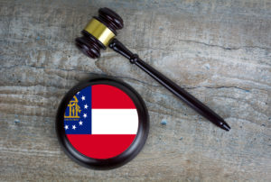 Wooden judgement or auction mallet with of Georgia flag