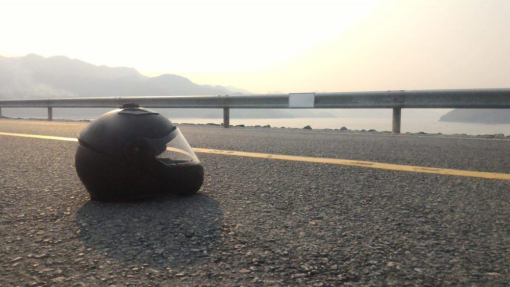 Closeup black helmet on the road.