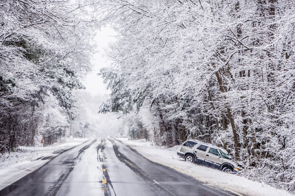 vehicle crashed into a tree after sliding off icy roadway