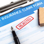auto insurance claim form with rejected in red stamp