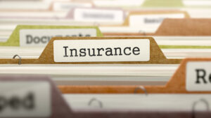closeup of Insurance listed on a file folder