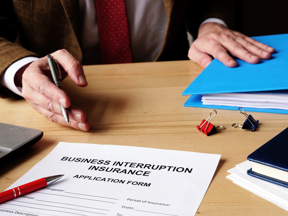 Panel Hears Arguments on Consolidation of Business Interruption Insurance Lawsuits Agent offers business interruption insurance application papers.