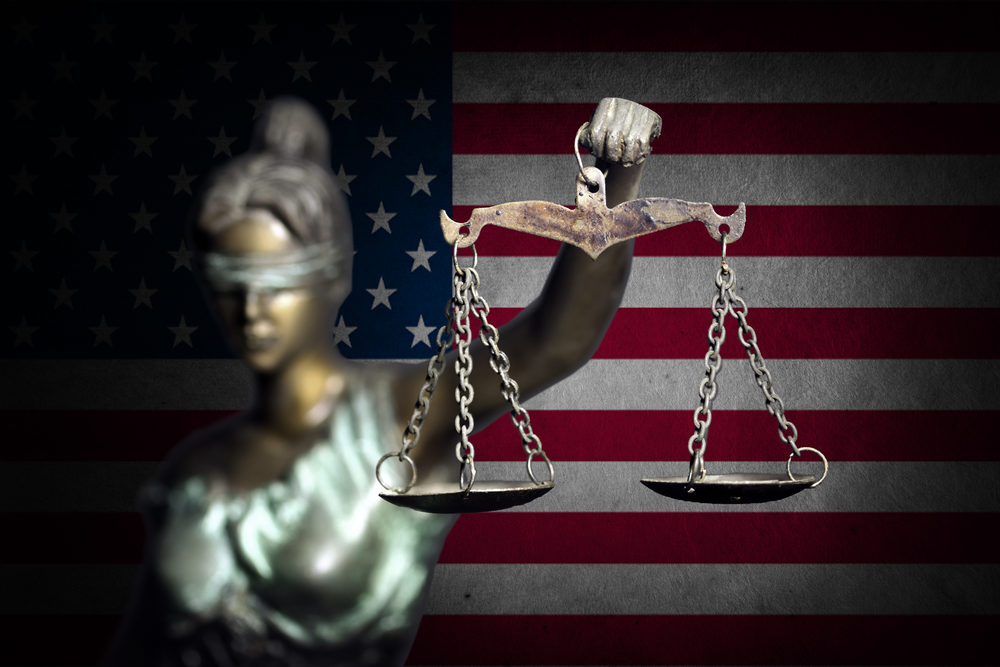 Lady justice with U.S flag background