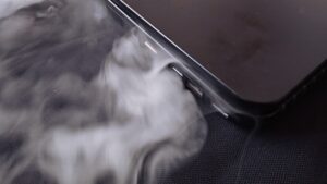 smoke coming out of a black laptop from lithium battery malfunction