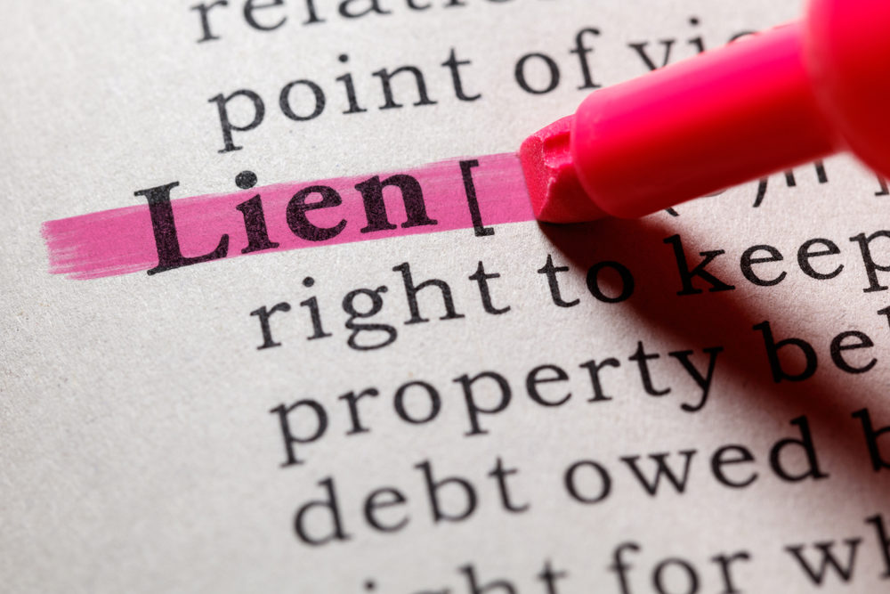 Third-Party Medical Lien Resolution – What Trial Lawyers Need to Know The word LIEN being highlighted by a pink marker in a dictionary