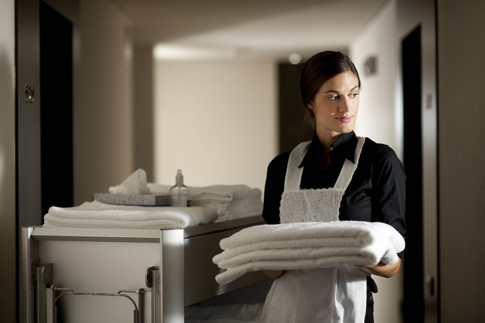 Maid with housekeeping cart