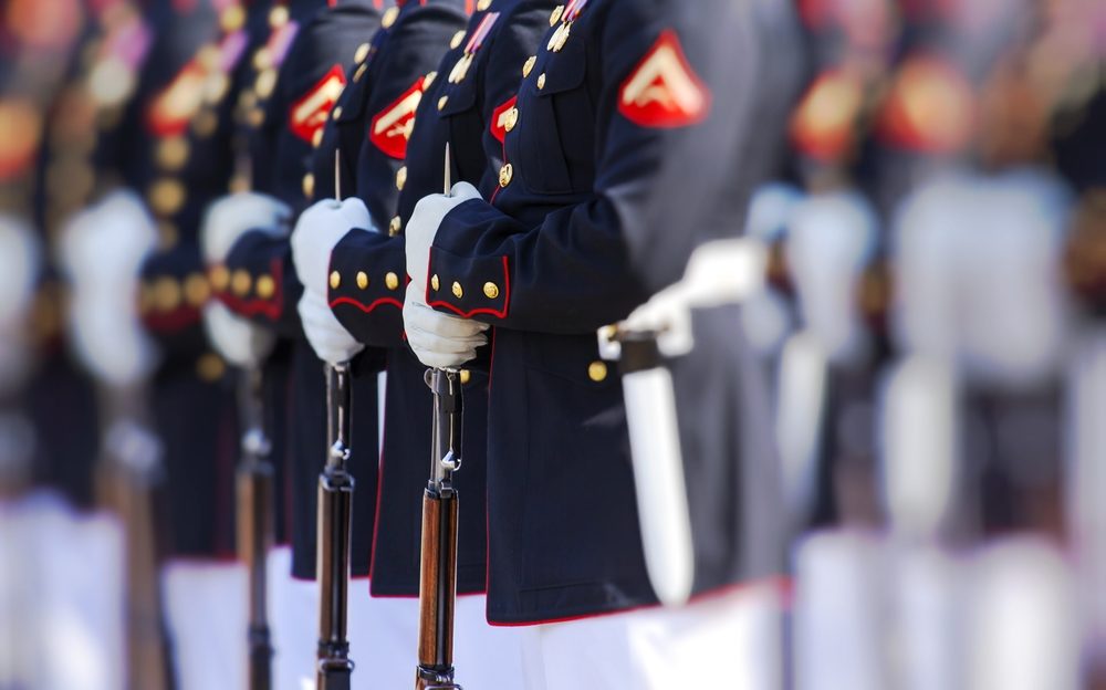 marine corps lineup of soldiers in dress uniform with rifles