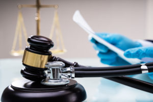 Medical Malpractice Litigation concept with gavel and stethoscope.