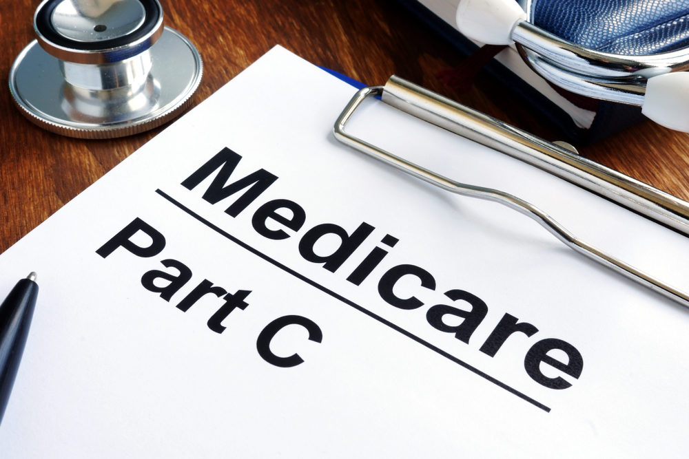 medicare part c forms on desk with a stethoscope