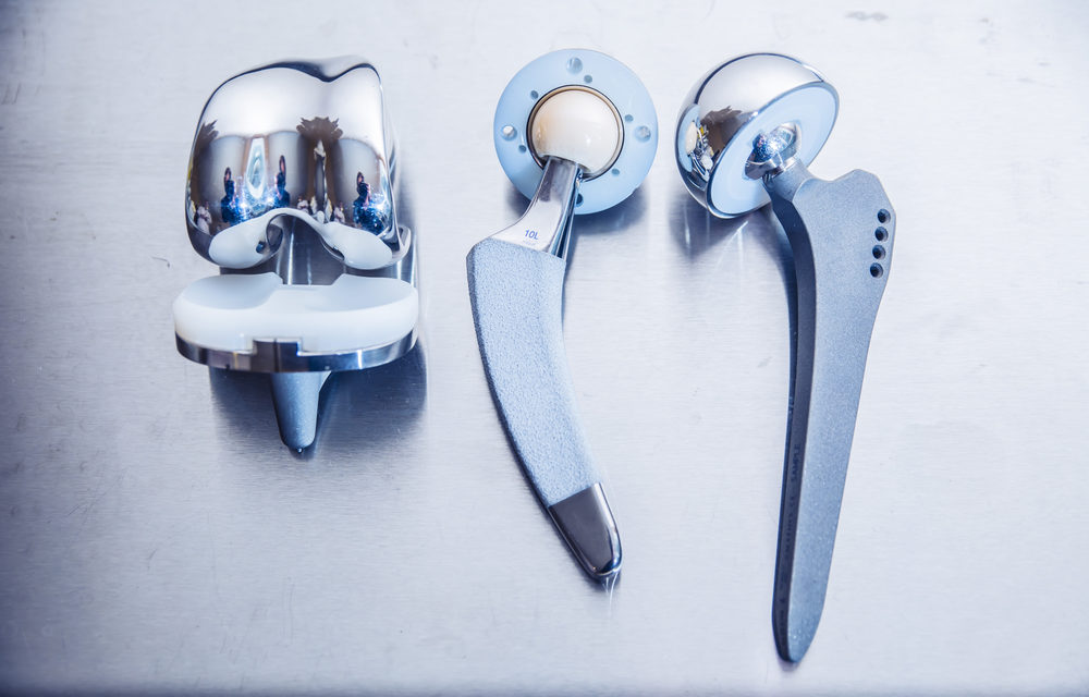 Exactech Financial Officer Fired and Sues Company over Hip and Knee Implant Recall Liability close up details for the transplantation of the joints of the feet lie against a metal surface
