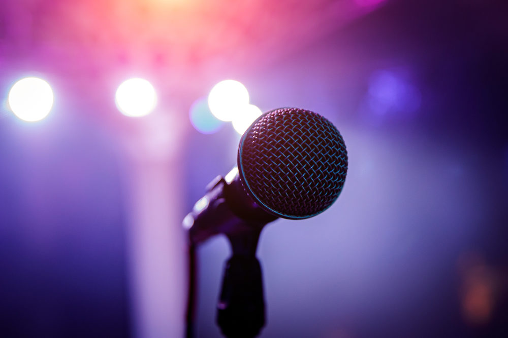 Microphone head on stage in a dark room