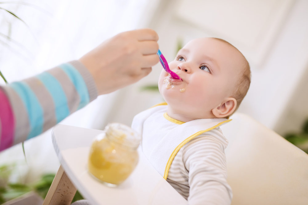 Close up of a mother feeding her baby