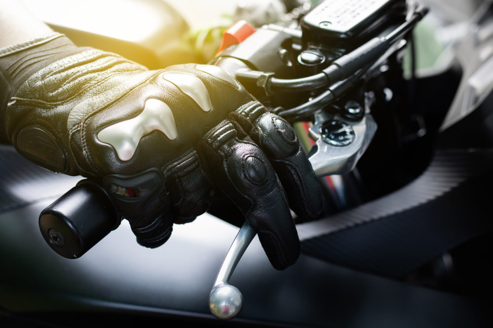 Close up of throttle control hand and brake lever motorcycle