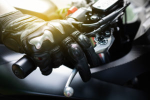 Close up of throttle control hand and brake lever motorcycle
