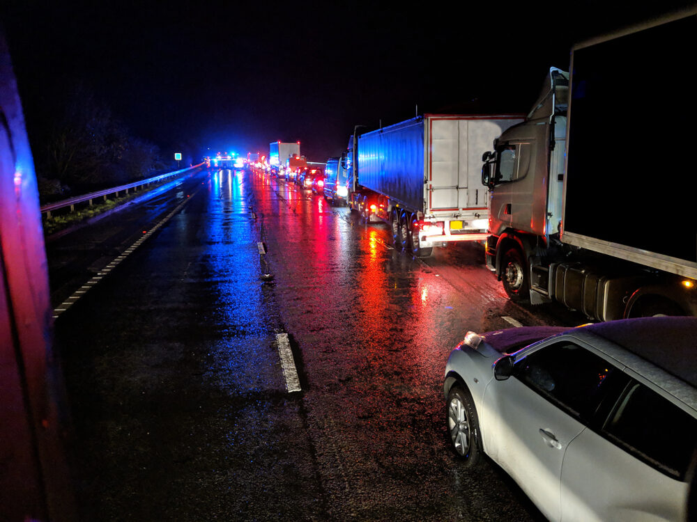 nighttime accident with backed up traffic on highway