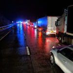 nighttime accident with backed up traffic on highway