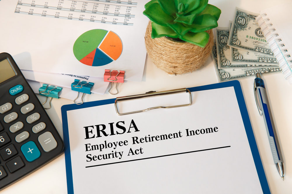 Personal Injury Attorney May Be Sued by ERISA Plan for Funds in Attorney’s Possession Paper with Employee Retirement Income Security Act ERISA on the office desk