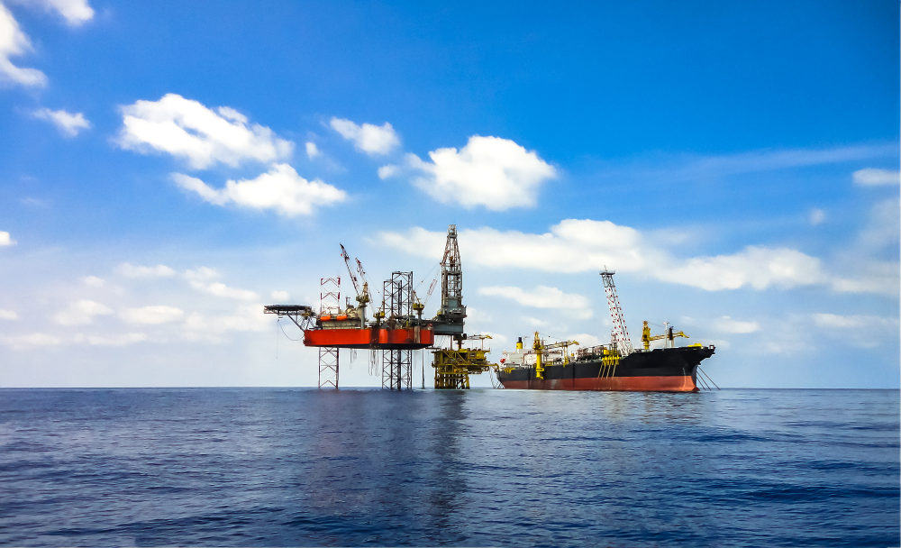 Offshore oil field area viewed with FPSO ship and drilling rig on platform