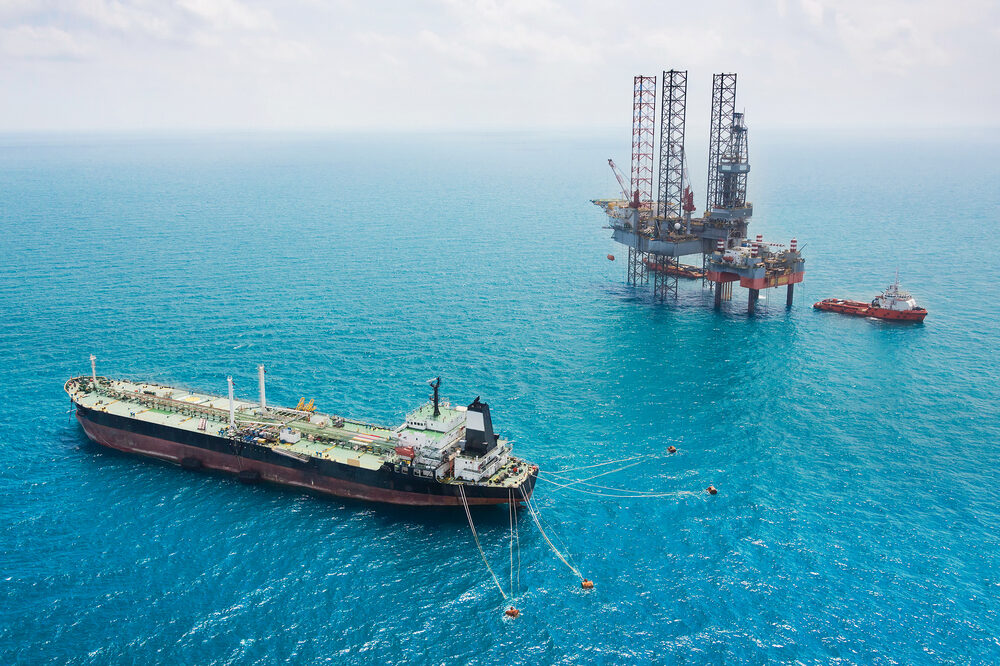 oil tanker near oil rig offshore in the gulf