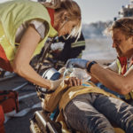 Paramedics Saving Life of a Traffic Accident Victim who is Lying on Stretcher