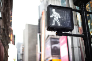 pedestrian crossing sign at traffic light in Manhattan