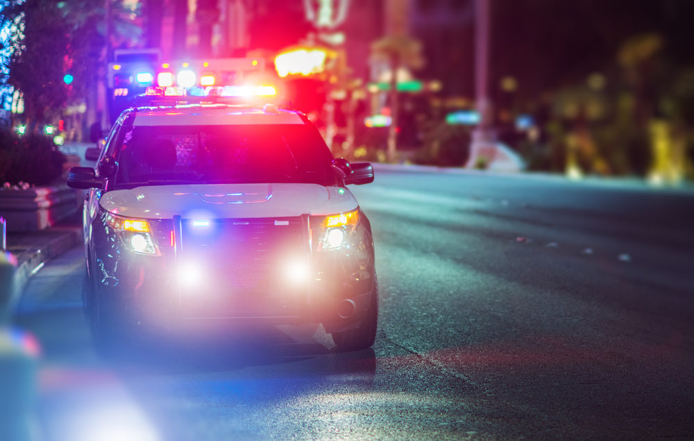 Sport Utility Vehicle Police Cruiser Emergency Assistance on the City Street.