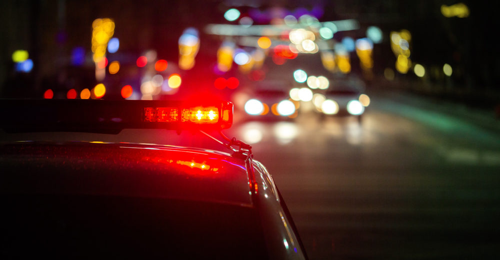 DUI Accident In Lemoore CA Claims Lives of Two Fresno Men police car lights in night city with selective focus