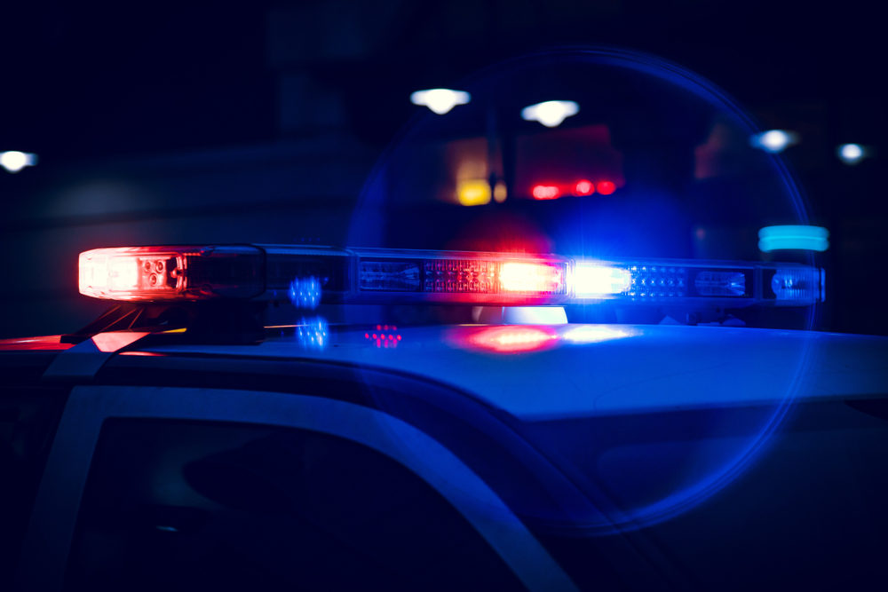 Closeup of Police Lights on Dark Street at Night