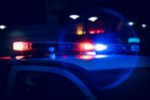 Closeup of Police Lights on Dark Street at Night