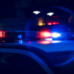 Closeup of Police Lights on Dark Street at Night