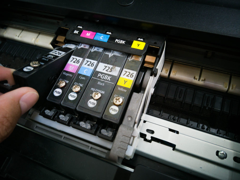 Printer ink cartridges being replaced