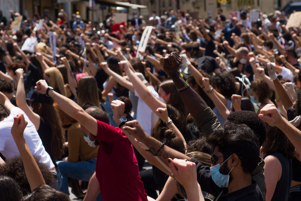 What Does Defunding the Police Really Mean? Protestors against racism and the killing of Geoge Floyd.