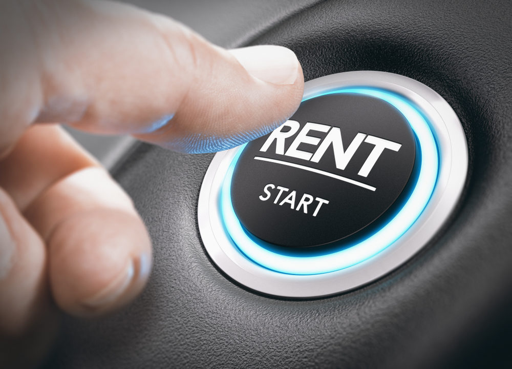 Man pushing a start button with the word rent.
