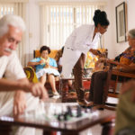 black female doctor testing a resident in a retirement home for seniors