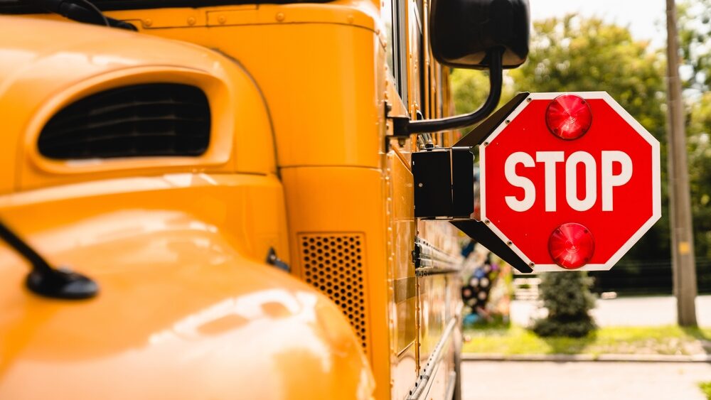 Crawford School Bus Crash: Nine Students and Adult Injured in Collision with Truck Heading to Edward J. Russell Elementary School yellow school bus with stop sign out