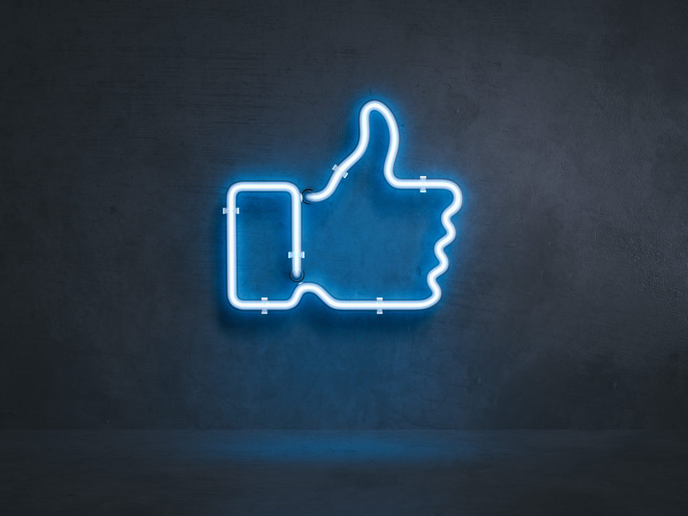 Neon sign of the Facebook thumbs up "like" icon 