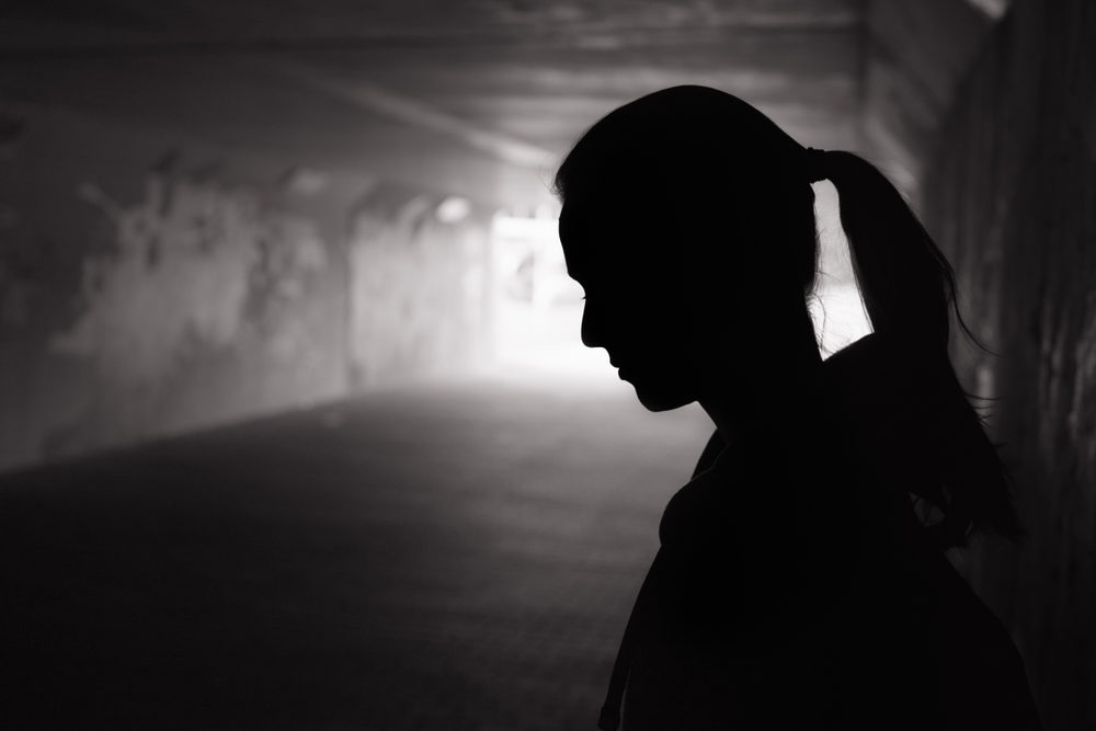 39 Victims File Lawsuits Alleging Decades of Sexual Abuse at Good Shepherd Services Youth Facility in Maryland Silhouette of a young female standing in a dark tunnel