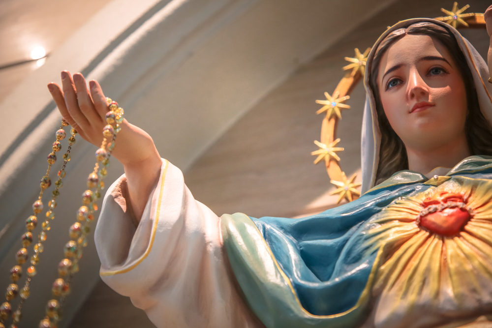 Close-up of a colorful statue of Our Lady of the Holy Rosary