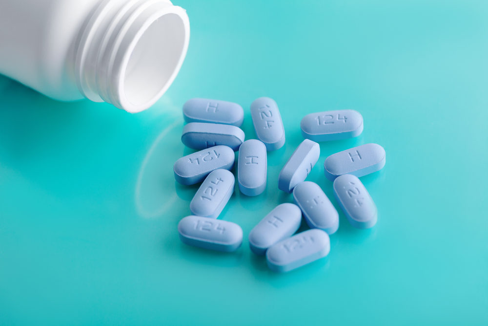 Pfizer Faces New Chantix Class-Action Lawsuit for Nitrosamine Impurities Pre-Exposure Prophylaxis (PrEP) pills spilled from an open bottle