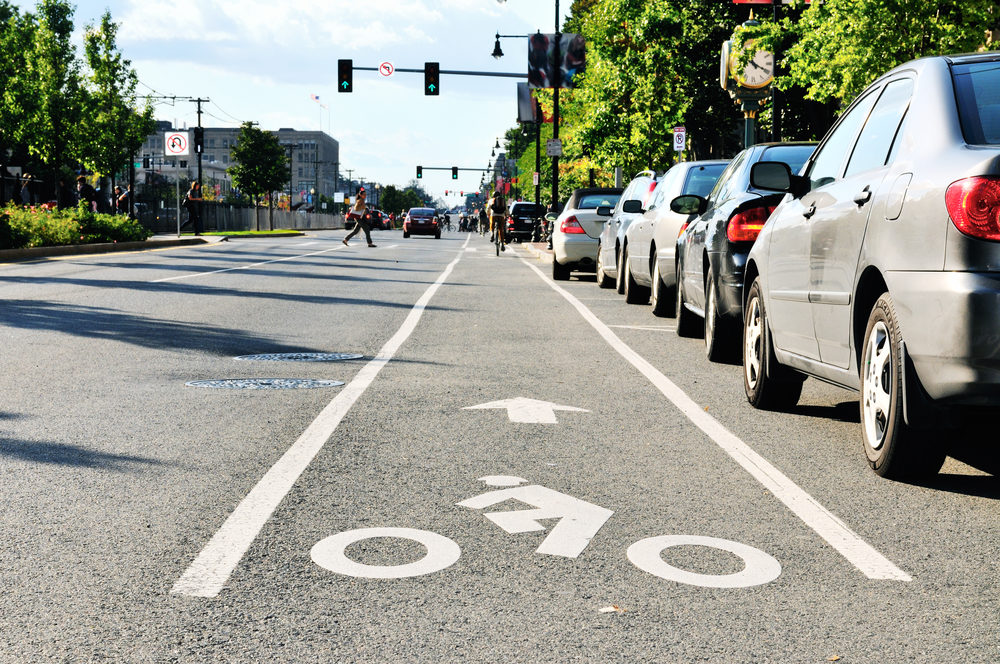 A marked bike lane on a busy city street