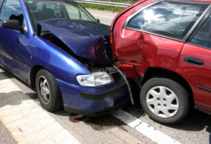 Two vehicles with extensive damage after a read-end collision