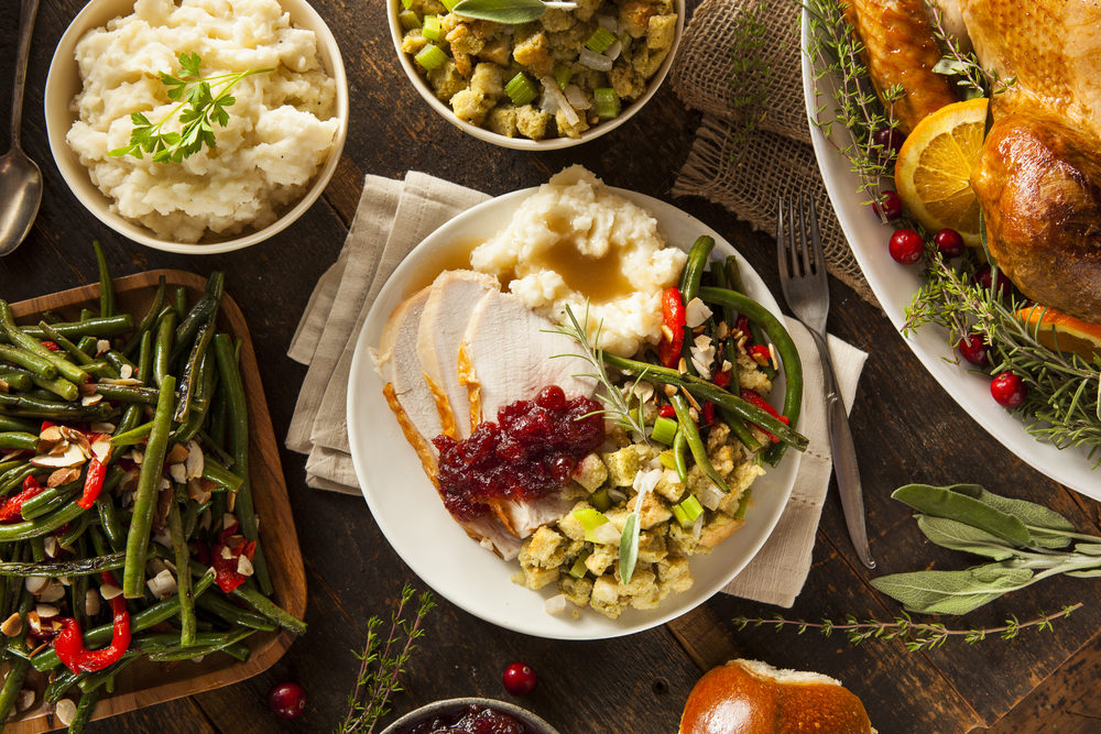 Turkey dinner on a plate with stuffing and mashed potatoes